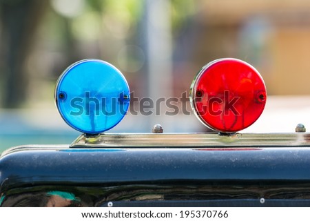 Red And Blue Sirens On Car Top