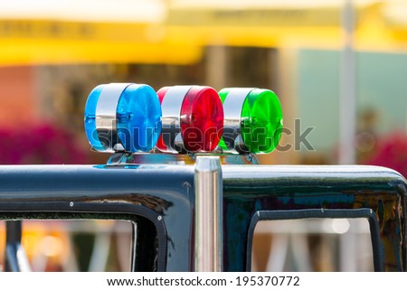 Blue, Red And Green Sirens On Car Top