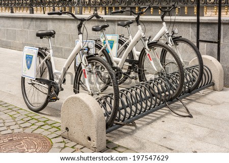 BUCHAREST, ROMANIA - JUNE 08, 2014: Bicycle Sharing System Downtown Bucharest. Is a service in which bicycles are made available for shared use to individuals on a very short term basis.