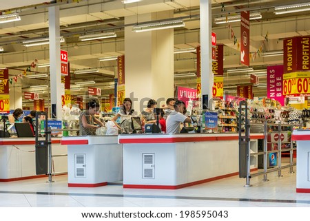 BUCHAREST, ROMANIA - JUNE 14: People Check Out At Local Supermarket on June 14, 2014 in Bucharest, Romania.