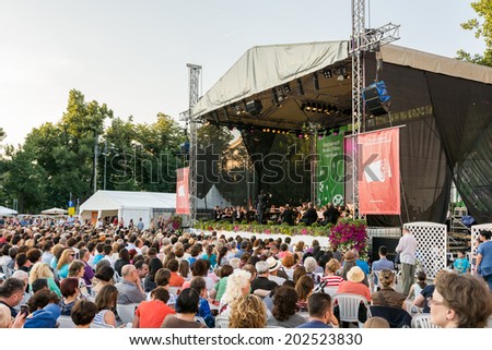 BUCHAREST, ROMANIA - JUNE 28, 2014: People Watching Free Classical Music Concert At Bucharest Music Film Festival In George Enescu Square Near The Romanian Athenaeum.