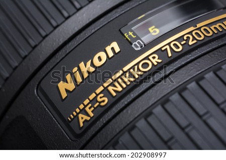 BUCHAREST, ROMANIA - JULY 05, 2014: Nikon 70-200 f/2.8 Lens For Digital Single Lens Reflex Camera. Founded in 1917 is a Japanese multinational corporation specializing in optics and imaging products.