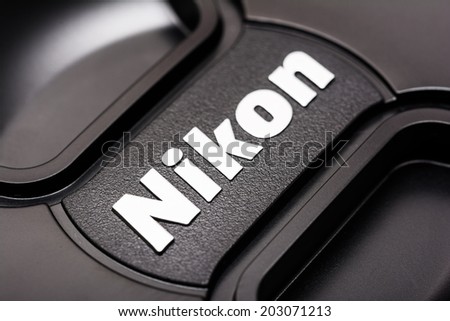 BUCHAREST, ROMANIA - JULY 05, 2014: Nikon Sign On Dslr Lens. It is a Japanese multinational corporation headquartered in Tokyo, Japan, specializing in optics and imaging products.
