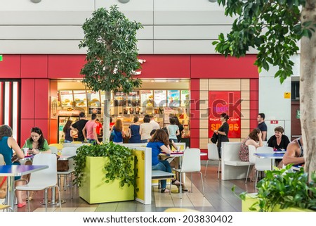 BUCHAREST, ROMANIA - JULY 07: People Eating At Fast Food Restaurants In Luxurious Shopping Mall on July 07, 2014 In Bucharest, Romania.