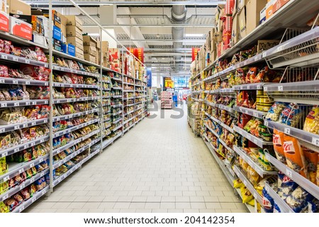 BUCHAREST, ROMANIA - JULY 09, 2014: Junk Food For Sale In Supermarket Aisle.