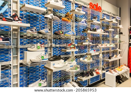 BUCHAREST, ROMANIA - JULY 18, 2014: Adidas Shoes In Shoe Store Display. Is a German multinational corporation that designs and manufactures sports clothing and accessories based in Germany.