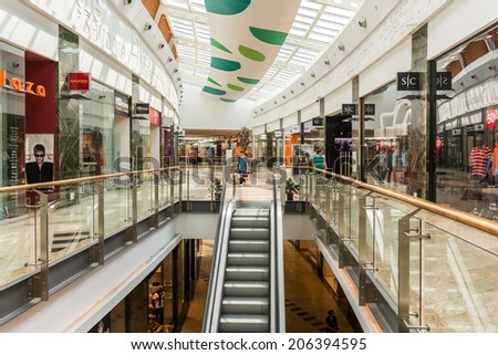 BUCHAREST, ROMANIA - JULY 21, 2014: People Shopping In Luxury Shopping Mall Interior.