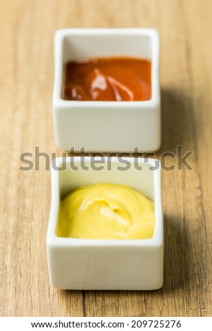 Mustard And Ketchup Sauce In White Bowl