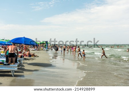 MAMAIA, ROMANIA - AUGUST 05, 2014: People Having Fun In The Sun On Mamaia Beach At The Black Sea.
