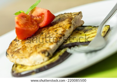 Grilled Egg Plant Slice With Pork Steak And Sliced Tomatoes