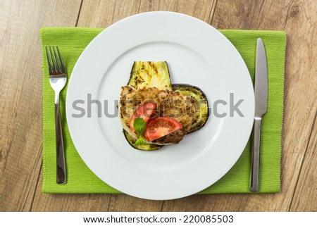 Grilled Egg Plant Slice With Pork Steak And Sliced Tomatoes