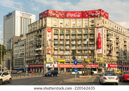 BUCHAREST, ROMANIA - AUGUST 06, 2014: The Roman Square (Piata Romana) is a major traffic intersection in downtown Sector 1 and the main building is the Academy of Economic Studies.