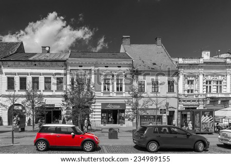 CLUJ NAPOCA, ROMANIA - AUGUST 22, 2014: Red Mini Cooper Car Downtown In The Old Center Of Cluj Napoca.