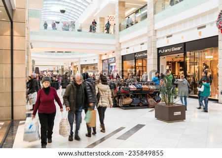 BUCHAREST, ROMANIA - DECEMBER 01, 2014: People Shopping For Christmas In Luxury Shopping Mall Interior.