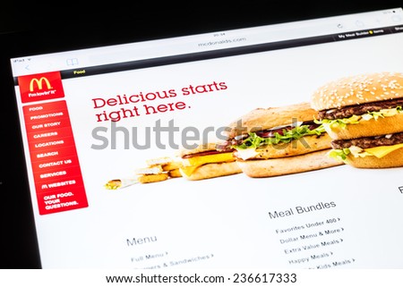 BUCHAREST, ROMANIA - DECEMBER 09, 2014: McDonald\'s Website On Apple iPad Air Tablet. Founded in 1940 in The United States it is the world\'s largest chain of hamburger fast food restaurants.