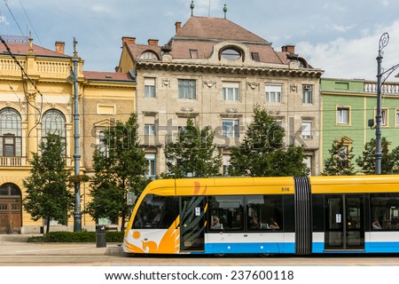 DEBRECEN, HUNGARY - AUGUST 23, 2014: Modern Tram On Market Street Or Piac Utca, One Of The Most Important Streets In Debrecen.