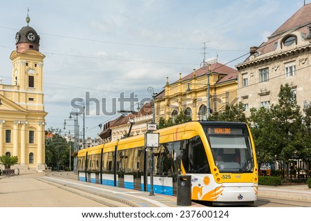 DEBRECEN, HUNGARY - AUGUST 23, 2014: Modern Tram On Market Street Or Piac Utca, One Of The Most Important Streets In Debrecen.