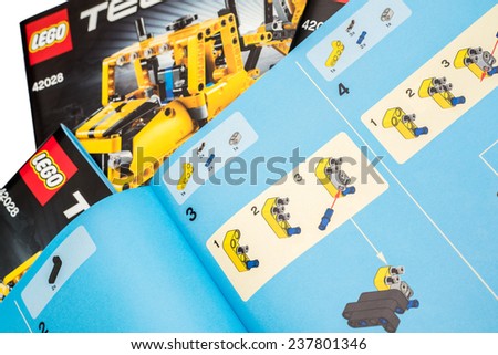 BUCHAREST, ROMANIA - DECEMBER 14, 2014: Lego Technic Instruction Manual. Technic is a line of Lego interconnecting plastic rods and parts that creates more advanced models.