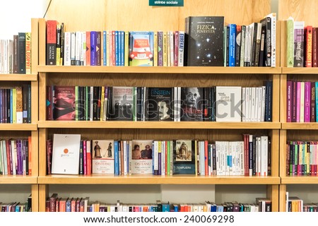 BRASOV, ROMANIA - DECEMBER 22, 2014: Bookshelf In Library With Many International Books For Sale.