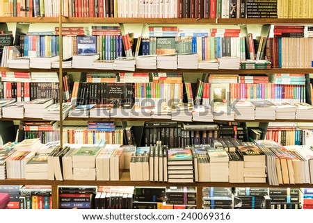 BRASOV, ROMANIA - DECEMBER 22, 2014: Bookshelf In Library With Many International Books For Sale.