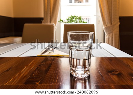 Glass Of Water On Vintage Restaurant Table