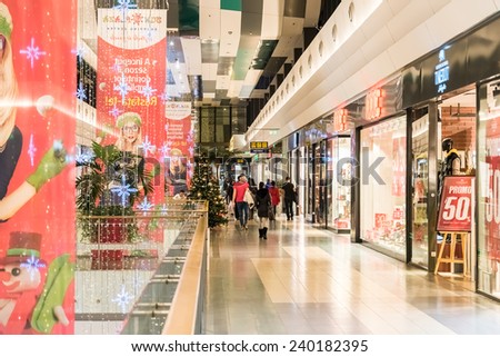 BUCHAREST, ROMANIA - DECEMBER 24, 2014: People Shopping For Christmas In Luxury Shopping Mall Interior.