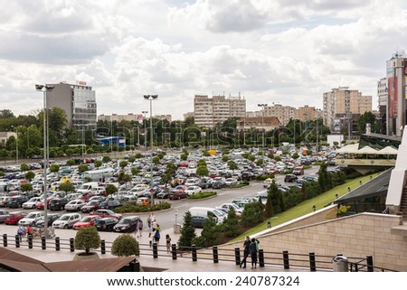 TIMISOARA, ROMANIA - AUGUST 24, 2014: Lots Of Cars Parked In Large Public Parking Lot.