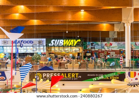 TIMISOARA, ROMANIA - AUGUST 24, 2014: People Crowd Eating Subway Sandwiches Fast Food On Restaurant Floor In Luxurious Shopping Mall.