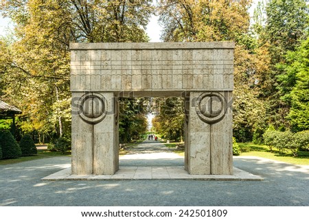 TARGU JIU, ROMANIA - AUGUST 26, 2014: The Gate of the Kiss is a stone sculpture made by Constantin Brancusi in 1938 and symbolizes the triumph of life over death.