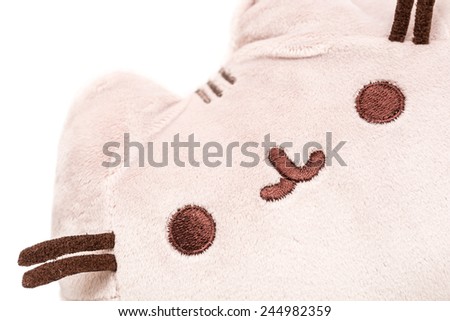 BUCHAREST, ROMANIA - JANUARY 18, 2015: Pusheen The Cat Plush Toy Isolated. Pusheen is an animated webcomic series created in 2010 that depicts the life and dreams of the titular gray tabby cat.