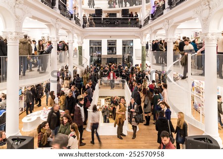 BUCHAREST, ROMANIA - FEBRUARY 12, 2015: People Crowd Rush On Buying Literature Books In Library.