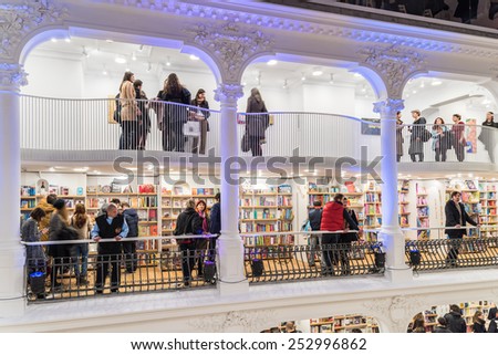 BUCHAREST, ROMANIA - FEBRUARY 12, 2015: People Crowd Rush On Shopping Literature Books In Library.