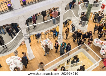 BUCHAREST, ROMANIA - FEBRUARY 12, 2015: People Crowd Rush On Shopping Literature Books In Library.