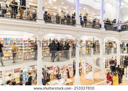 BUCHAREST, ROMANIA - FEBRUARY 13, 2015: People Shopping For Literature Books In Library.