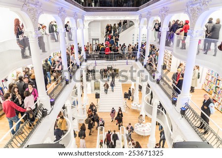 BUCHAREST, ROMANIA - FEBRUARY 13, 2015: People Shopping For Literature Books In Shopping Mall Library.