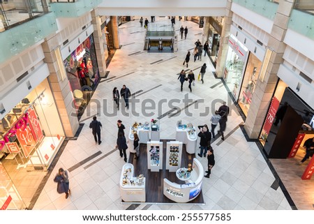 BUCHAREST, ROMANIA - JANUARY 27, 2015: People Shopping In Luxury Shopping Mall Interior.