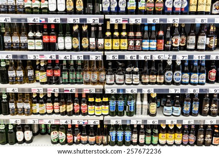 BUCHAREST, ROMANIA - FEBRUARY 28, 2015: Alcohol Bottles For Sale On Supermarket Stand.