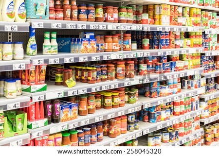 BUCHAREST, ROMANIA - MARCH 01, 2015: Canned Food And Special Sauces For Sale On Supermarket Stand.