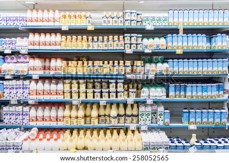 BUCHAREST, ROMANIA - MARCH 01, 2015: Fresh Milk Bottles On Supermarket Stand.