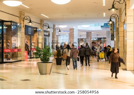 BUCHAREST, ROMANIA - MARCH 01, 2015: People Shopping In Luxury Shopping Mall Interior.