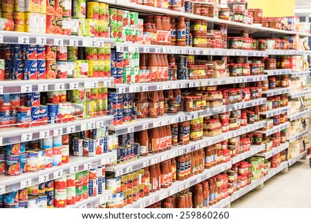 BUCHAREST, ROMANIA - MARCH 11, 2015: Canned Food For Sale On Supermarket Shelf.