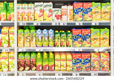BUCHAREST, ROMANIA - MARCH 15, 2015: Orange Juice Bottles On Supermarket Stand.