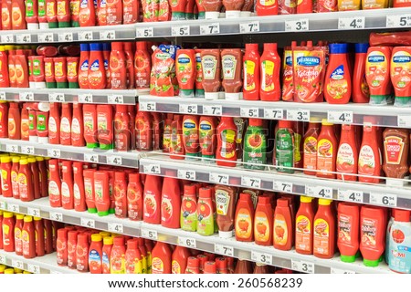 BUCHAREST, ROMANIA - MARCH 15, 2015: Ketchup Tomato Sauce Bottles On Supermarket Shelf.