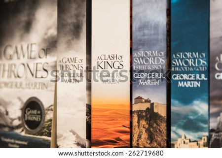 BUCHAREST, ROMANIA - MARCH 22, 2015: Game Of Thrones Books For Sale On Library Shelf. It is the first novel in a series of high fantasy novels by American author George R. R. Martin.