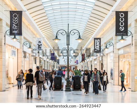 BUCHAREST, ROMANIA - MARCH 30, 2015: People Shopping In Luxury Shopping Mall Interior.