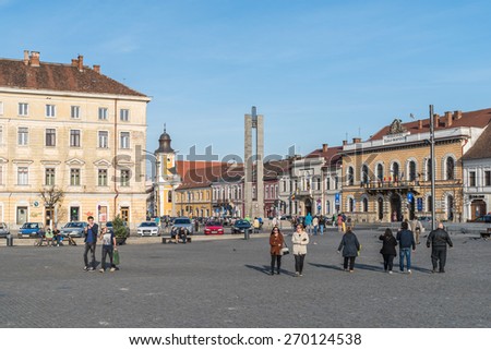 CLUJ NAPOCA, ROMANIA - APRIL 13, 2015: Tourists Walking Downtown In The Old Center Of Cluj Napoca.