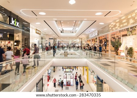 BUCHAREST, ROMANIA - JUNE 02, 2015: People Crowd Shopping In Luxury Mall Interior.