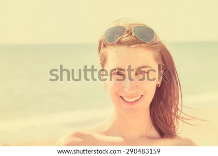 Retro Effect Of Pretty Young Woman Portrait Is Happy On Summer Ocean Beach