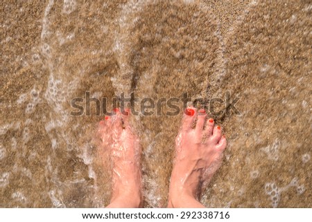 Ocean Sea Waves And Girl Feet On Summer Sand Beach