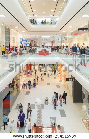BUCHAREST, ROMANIA - JULY 06, 2015: People Crowd Rush In Shopping Luxury Mall Interior.